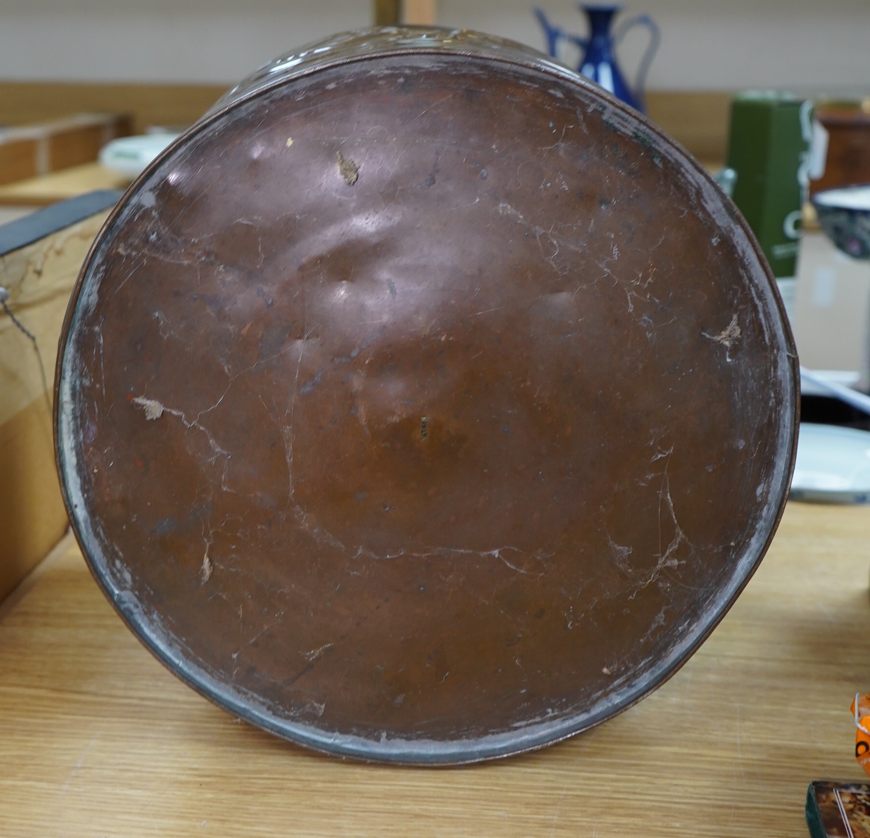 A large Arts and Crafts embossed copper jardiniere decorated with seahorses, stamped Newlyn to base, 28cm high, 33cm in diameter. Condition - good